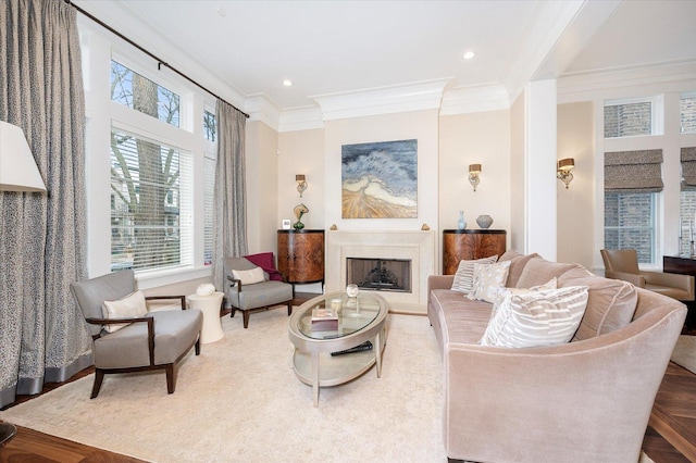 sitting room with a fireplace, ornamental molding, wood finished floors, and recessed lighting