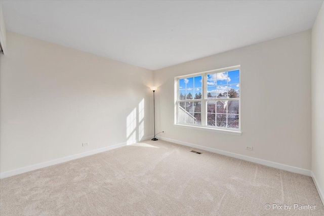 empty room featuring light carpet