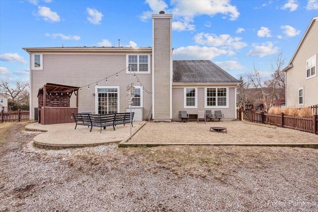 rear view of property with a patio area