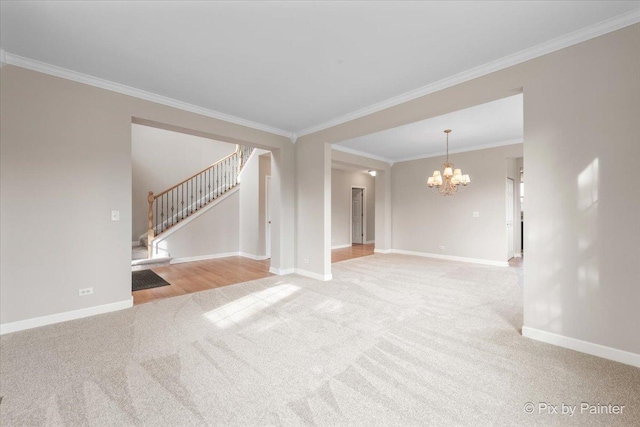 unfurnished living room with a chandelier, crown molding, and light carpet