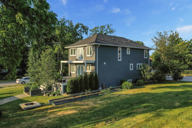 view of home's exterior featuring a yard