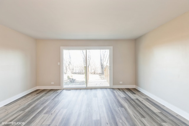 unfurnished room featuring light hardwood / wood-style floors