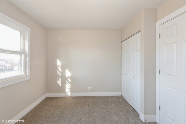 unfurnished bedroom featuring carpet