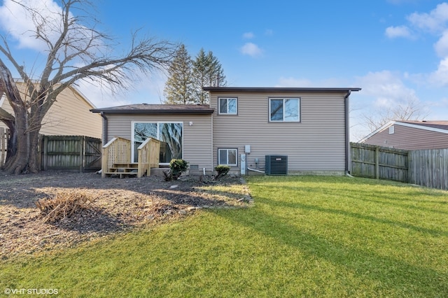 back of property with a yard and cooling unit