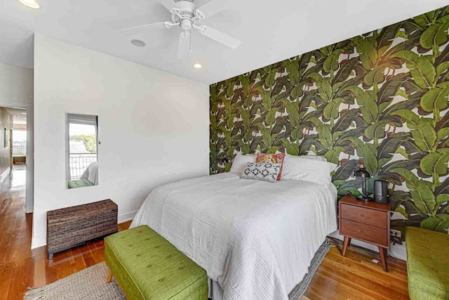 bedroom featuring hardwood / wood-style flooring and ceiling fan