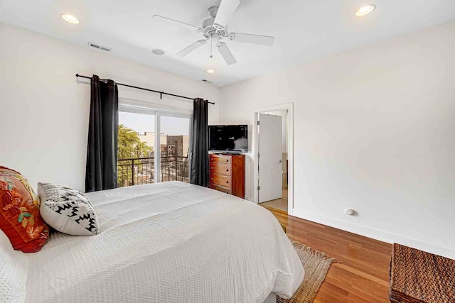 bedroom with ceiling fan, hardwood / wood-style flooring, and access to exterior