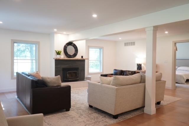 living room with a wealth of natural light and hardwood / wood-style flooring