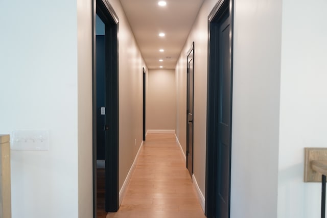 corridor featuring light wood-type flooring