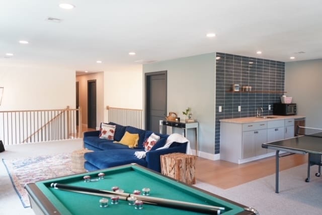 game room featuring billiards, indoor wet bar, and light hardwood / wood-style floors