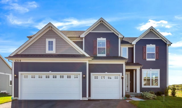 craftsman house with a garage