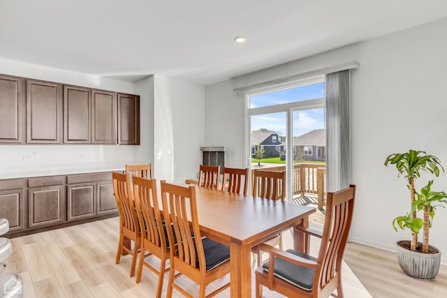 dining area with light hardwood / wood-style flooring