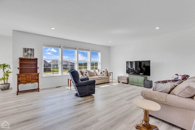 living room with light hardwood / wood-style floors