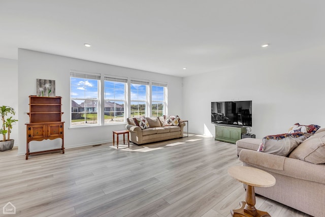 living room with light hardwood / wood-style floors