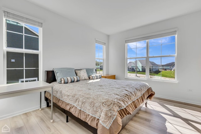 bedroom with light wood-type flooring