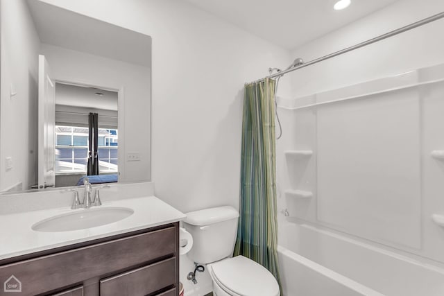 full bathroom featuring vanity, toilet, and shower / bath combo with shower curtain