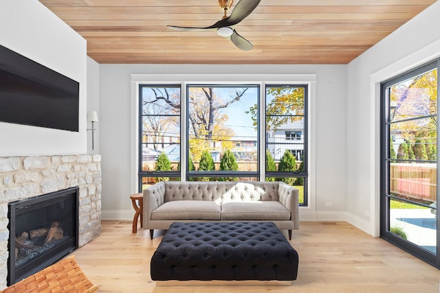 sitting room with plenty of natural light, ceiling fan, and light hardwood / wood-style flooring