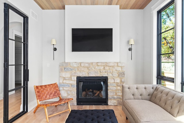 185 E Oneida Ave, Elmhurst, IL 60126 - living area with wood finished floors, a fireplace, wood ceiling, and baseboards