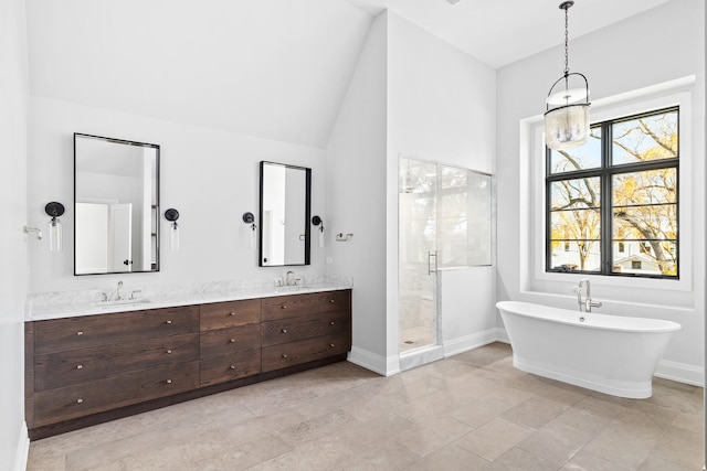 bathroom with lofted ceiling, vanity, independent shower and bath, and tile patterned flooring