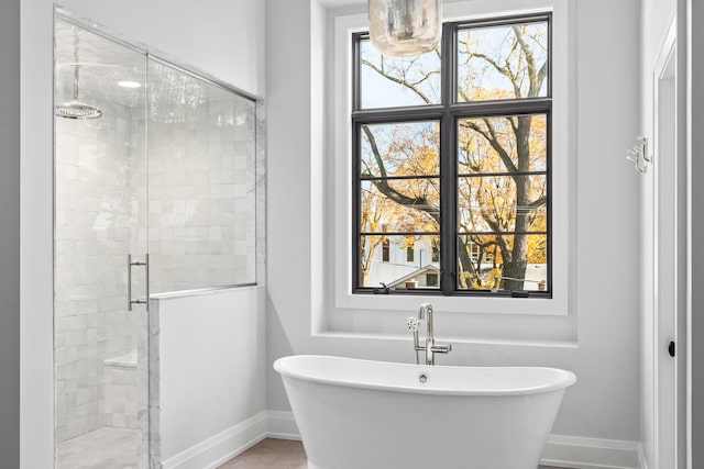 185 E Oneida Ave, Elmhurst, IL 60126 - full bath featuring a stall shower, a freestanding bath, and baseboards