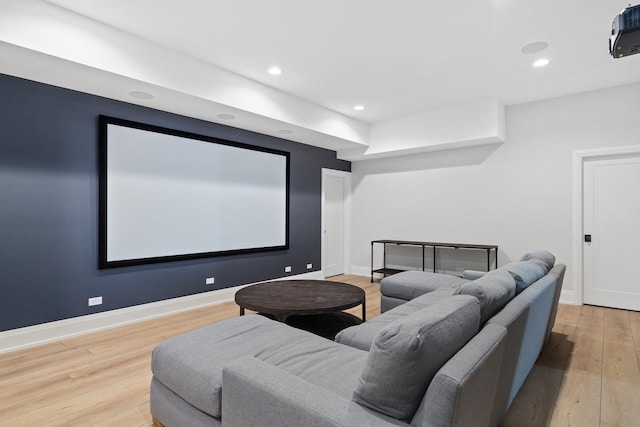 home theater with light wood-type flooring