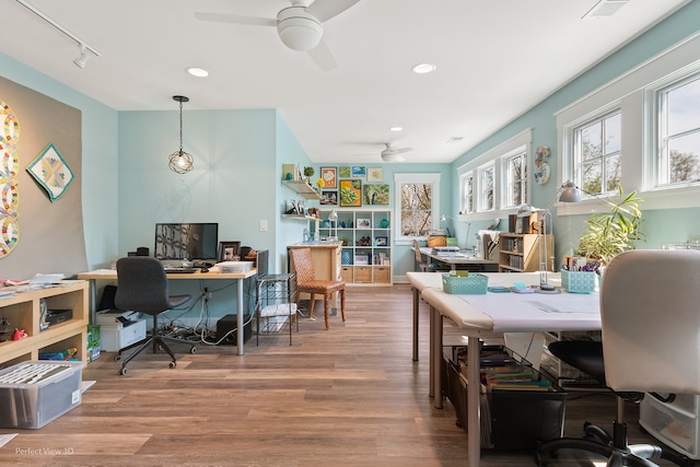 office area featuring hardwood / wood-style floors, ceiling fan, and rail lighting