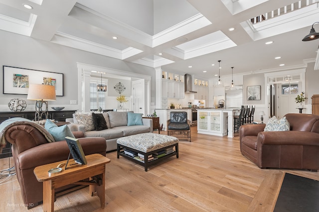 living room featuring coffered ceiling, beam ceiling, and light hardwood / wood-style floors