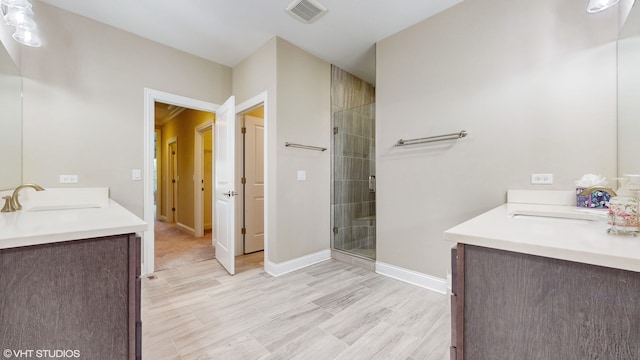 bathroom featuring vanity and an enclosed shower