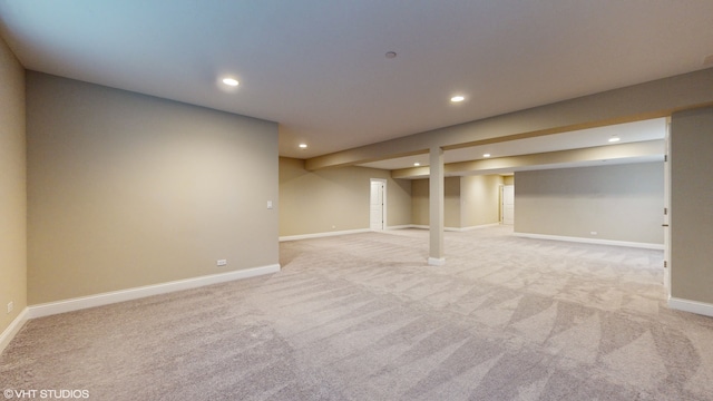 basement featuring light colored carpet