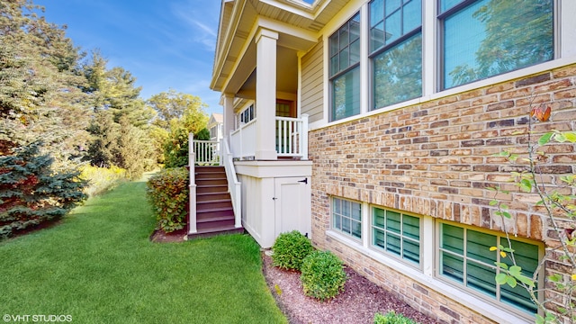 view of home's exterior with a yard