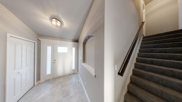8309 Dylan Dr, Merrillville, IN 46410 - foyer entrance with stairs and baseboards