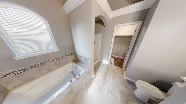 8309 Dylan Dr, Merrillville, IN 46410 - bathroom featuring a garden tub, a spacious closet, toilet, and ornamental molding