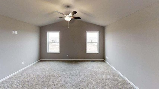 8309 Dylan Dr, Merrillville, IN 46410 - spare room with baseboards, lofted ceiling, carpet, and ceiling fan