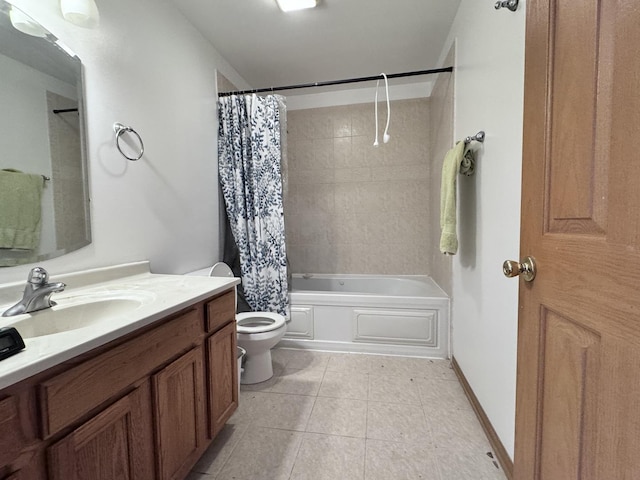 full bathroom featuring toilet, vanity, tile patterned floors, and shower / bath combo