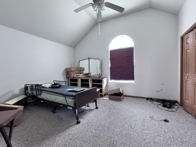 home office with ceiling fan, carpet flooring, and lofted ceiling