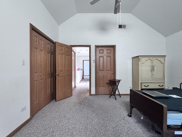 bedroom featuring ceiling fan, a closet, light carpet, and high vaulted ceiling