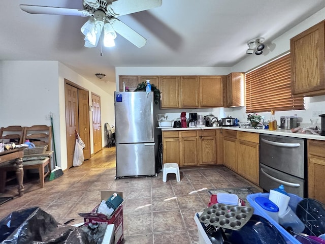 kitchen featuring ceiling fan and stainless steel refrigerator