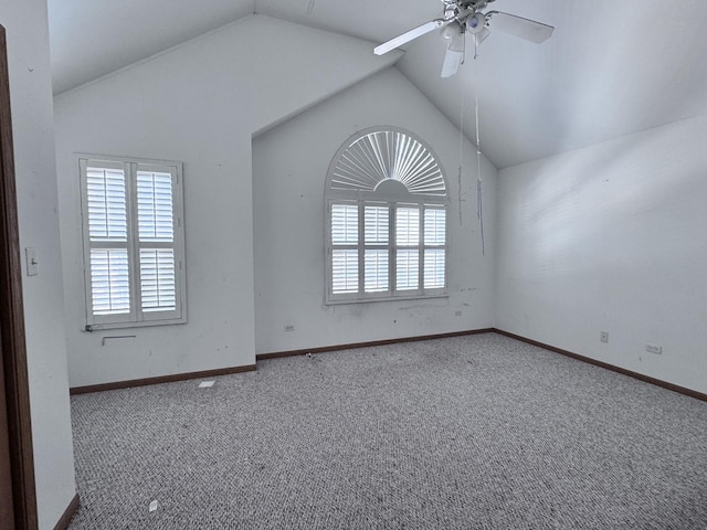 unfurnished room featuring ceiling fan, carpet, and lofted ceiling