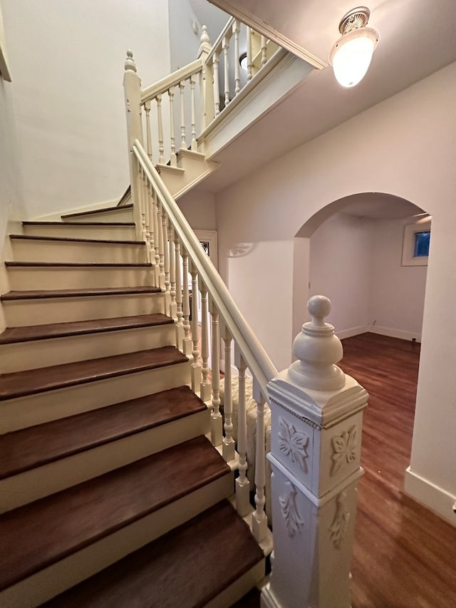 staircase featuring hardwood / wood-style floors