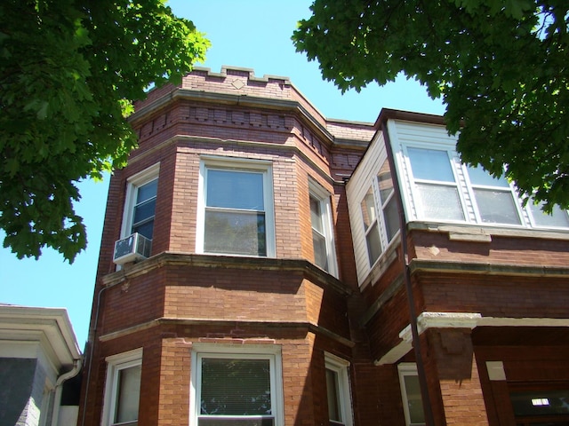 view of side of home featuring brick siding