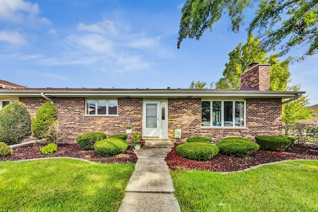 ranch-style house with a front lawn