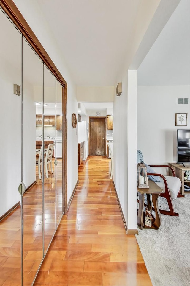 corridor featuring light hardwood / wood-style flooring