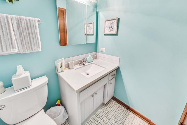 bathroom with vanity, toilet, and tile patterned flooring