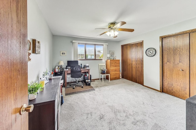 office featuring light colored carpet and ceiling fan