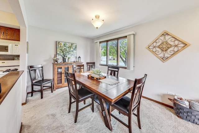 dining area featuring carpet