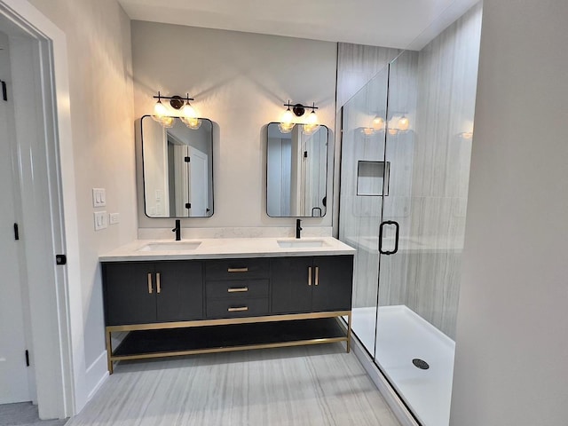 bathroom featuring vanity and a shower with shower door