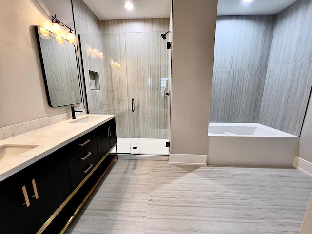 bathroom featuring vanity and plus walk in shower