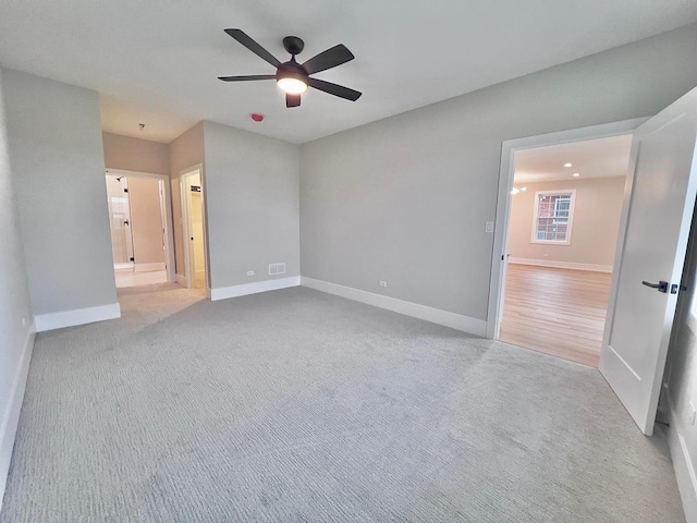 unfurnished bedroom with ceiling fan and light colored carpet