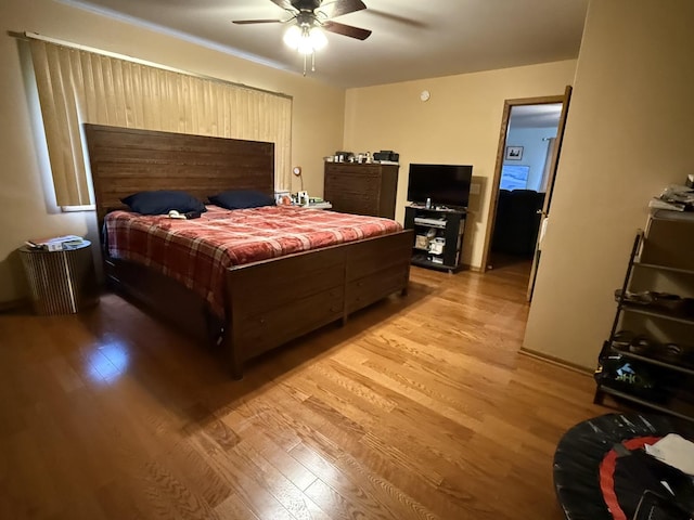 bedroom featuring ceiling fan and light wood-type flooring