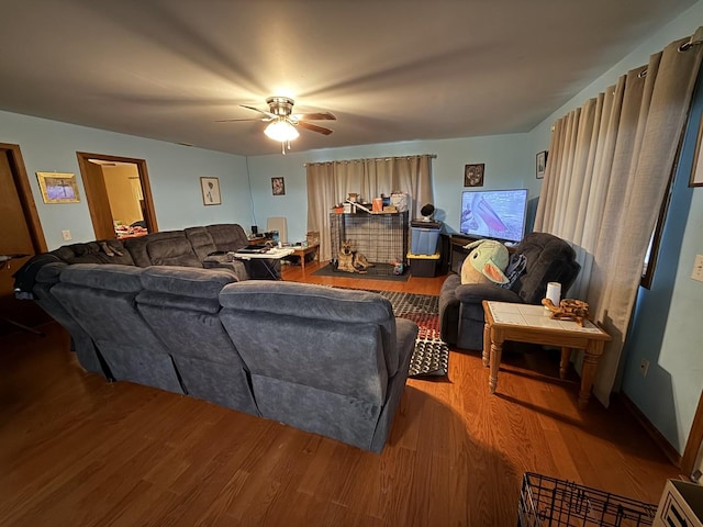 living room with hardwood / wood-style floors and ceiling fan