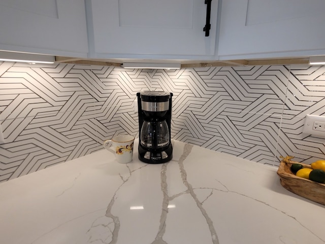 room details with light stone counters and white cabinets